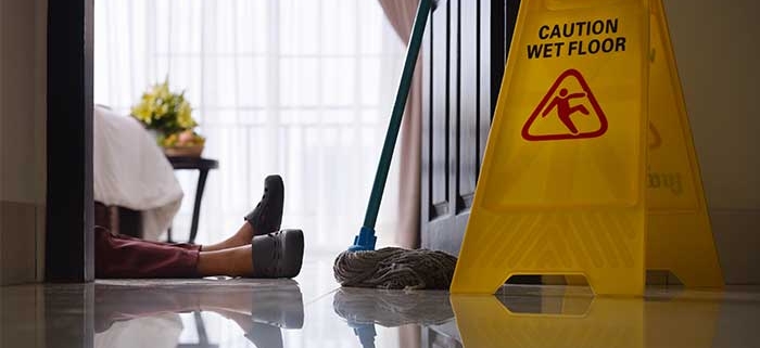 A "caution: wet floor" safety sign. Legal help for slip-and-fall and trip-and-fall accident victims in Jackson, MS.