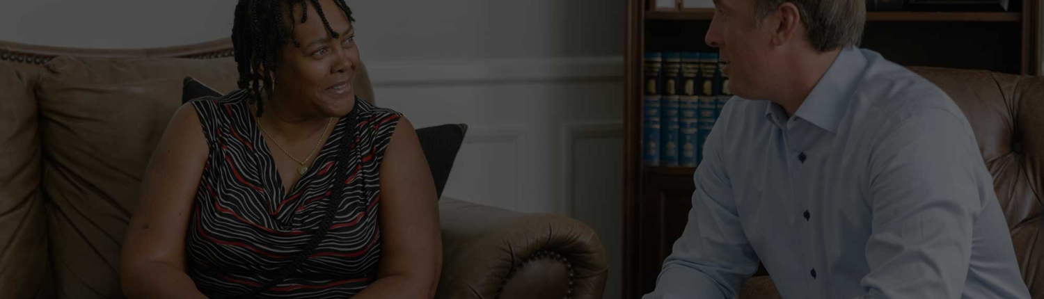 Mass torts lawyers consulting with a client about a case.