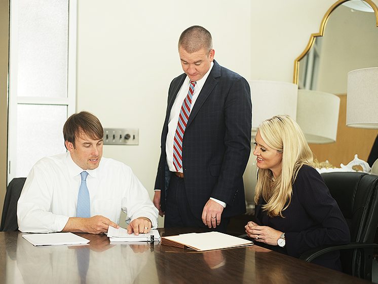 A personal injury lawyer working with a client on a case.